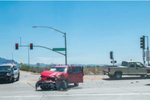 crushed red car at intersection