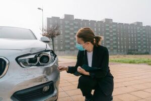 woman checking a car